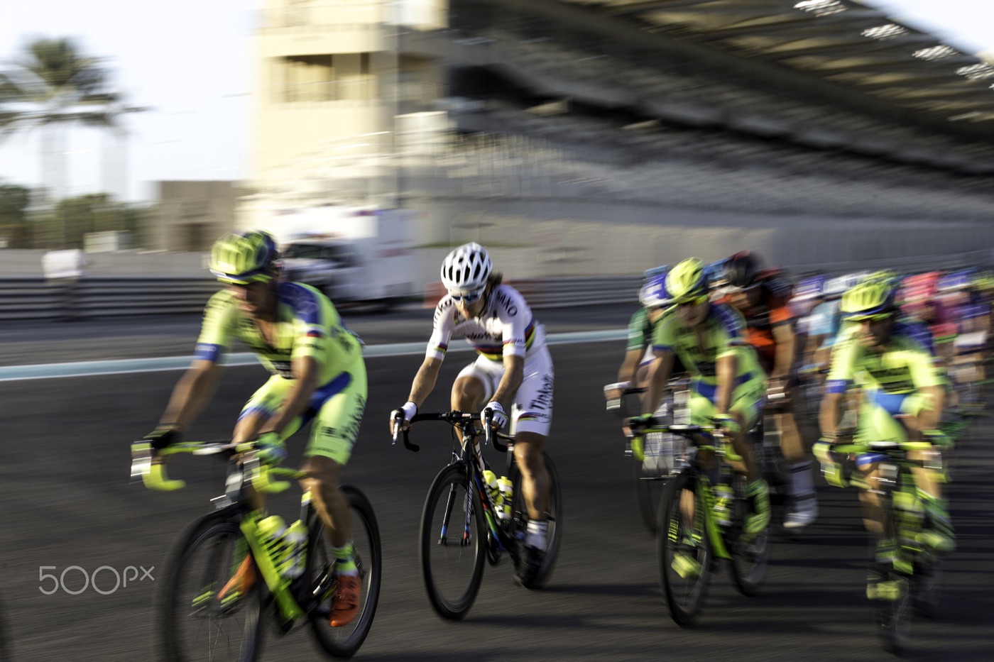 The peloton racing on the Yas Marina Circuit tarmac